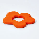 side view of natural rubber orange flower shaped teething toy by Lanco pictured on a plain white background