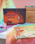 Land of Elves children's hardback book by Daniela Drescher on a shelf next to another series book Land of the Fairies.