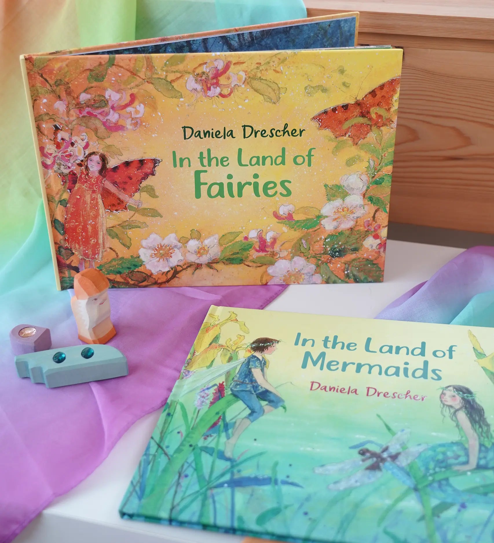 Land of Fairies children's hardback book by Daniela Drescher on a shelf next to another series book Land of the Mermaids.