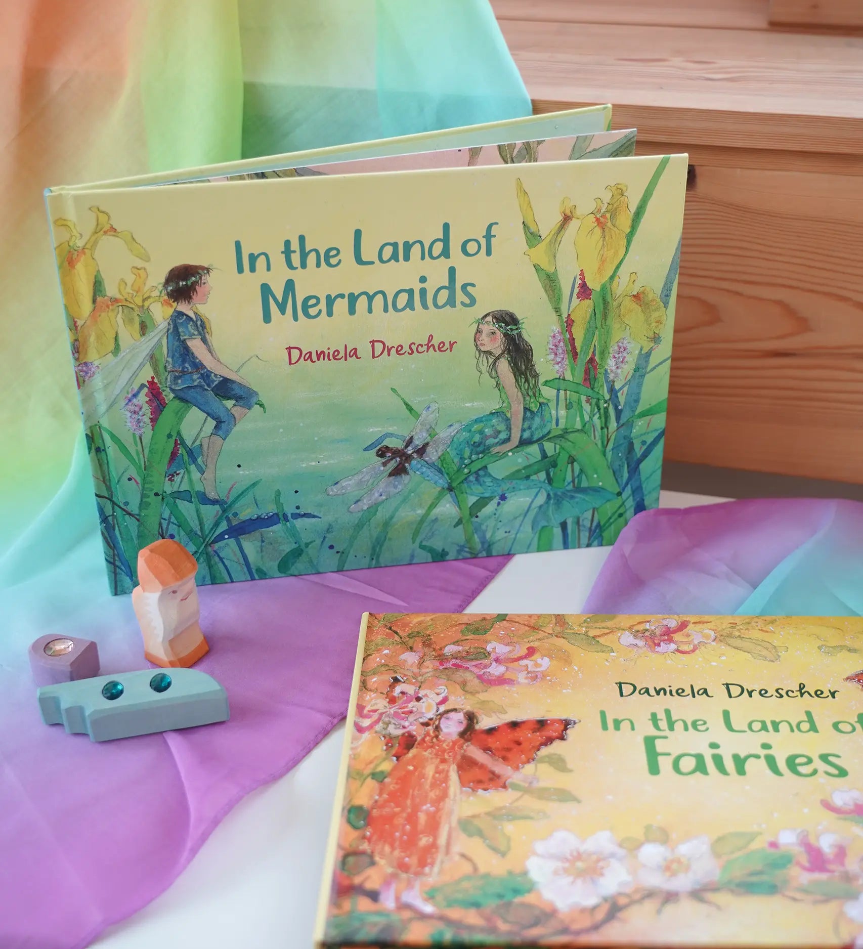 Land of Mermaids children's hardback book by Daniela Drescher on a shelf next to another series book Land of the Fairies.