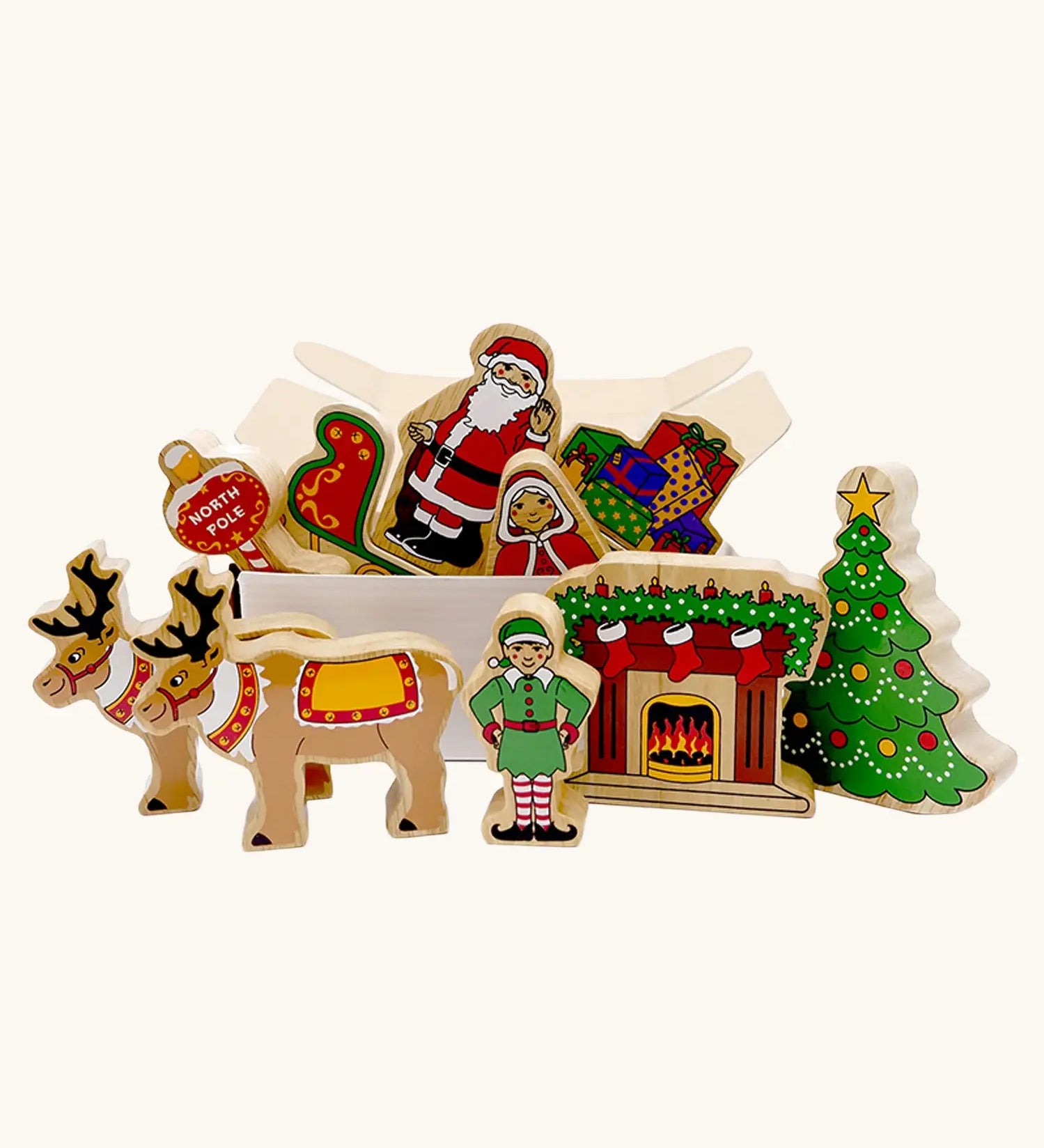 Lanka Kade wooden Christmas play set. 10 toy figures including Father Christmas,  red sleigh, Mrs Clause, Wrapped presents, festive fireplace, Christmas Tree, North Pole Sign, Elf and 2 Reindeer in a cardboard box.