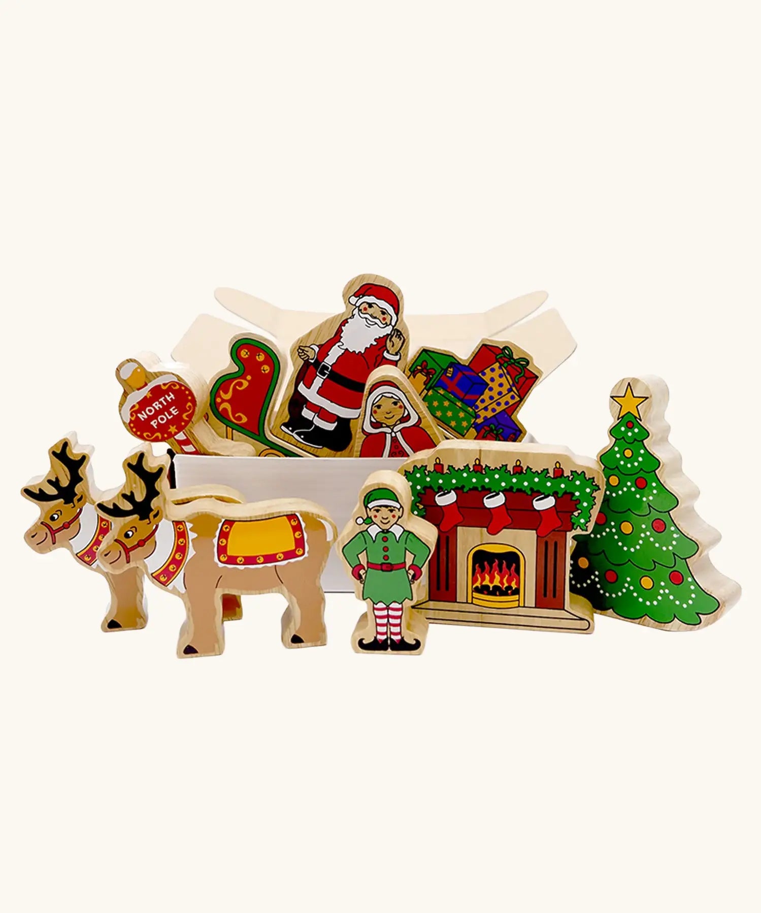 Lanka Kade wooden Christmas play set. 10 toy figures including Father Christmas,  red sleigh, Mrs Clause, Wrapped presents, festive fireplace, Christmas Tree, North Pole Sign, Elf and 2 Reindeer in a cardboard box.