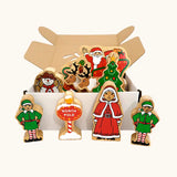 Lanka Kade wooden Christmas play set. 9 toy figures including Santa in his sleigh, Mrs Clause, Christmas Tree, Snowman, North Pole Sign, 2 Elves and 2 Reindeer in a cardboard box.