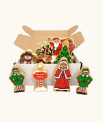 Lanka Kade wooden Christmas play set. 9 toy figures including Santa in his sleigh, Mrs Clause, Christmas Tree, Snowman, North Pole Sign, 2 Elves and 2 Reindeer in a cardboard box.