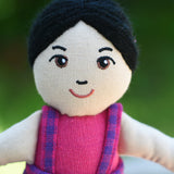 A close up of the face on the Lanka Kade Asian Girl Doll with White Skin and Black Hair.