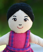 A close up of the face on the Lanka Kade Asian Girl Doll with White Skin and Black Hair.