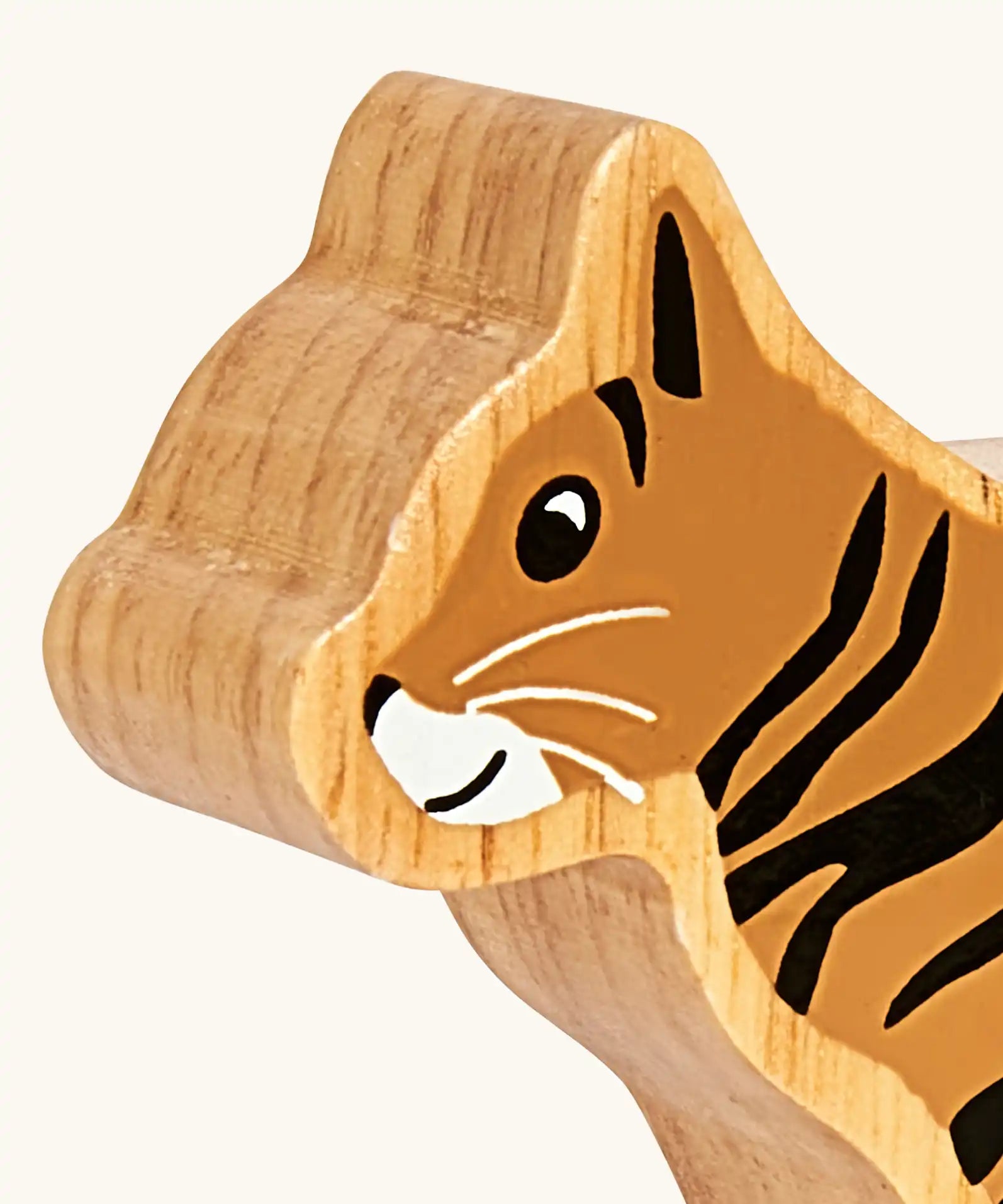 Close up of the painted facial features on the Lanka Kade Scottish wildcat wooden toy figure. 