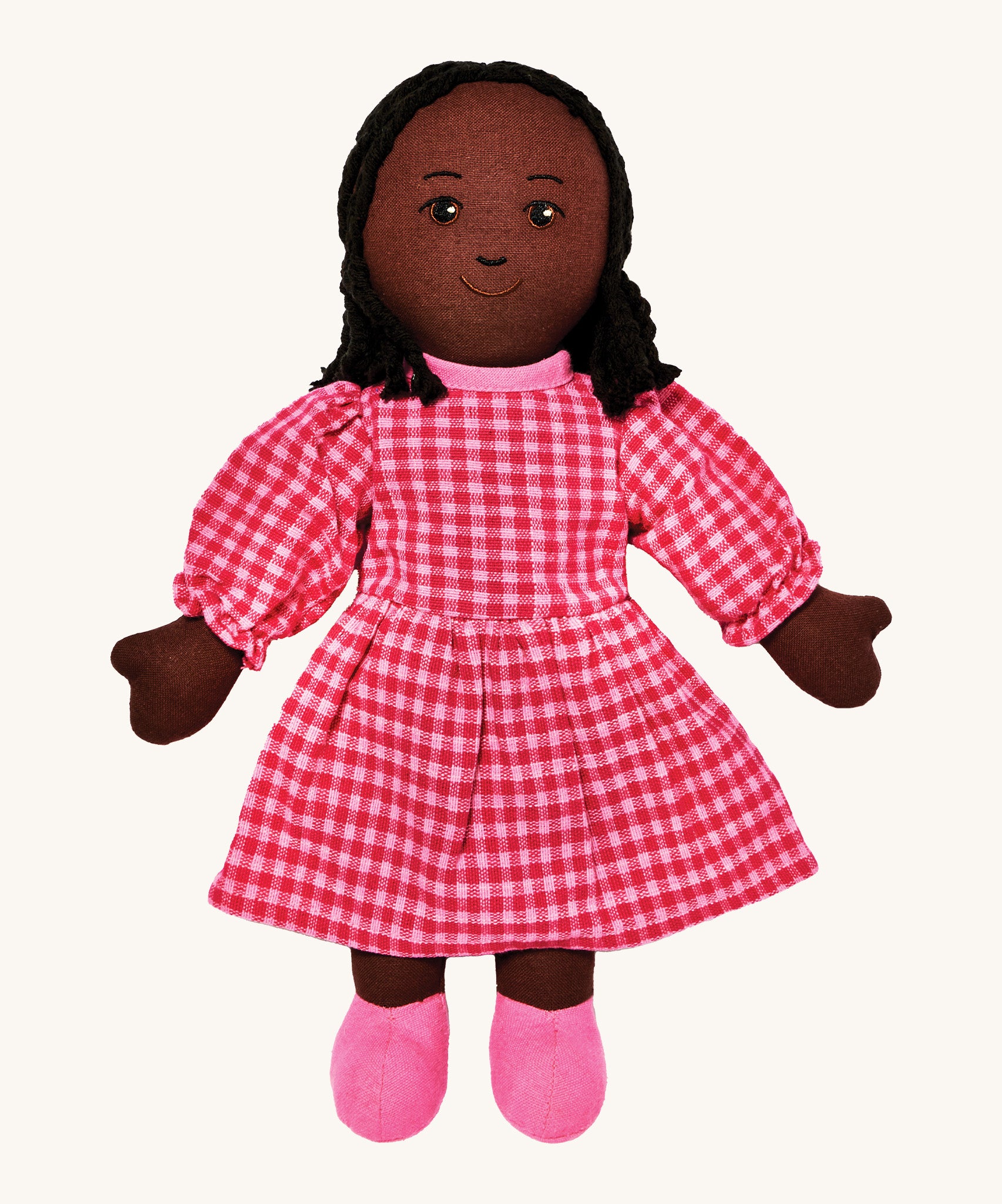 Lanka Kade mum doll with black skin and long black hair. Features a long dress in a multicoloured check style and stitched on shoes. 