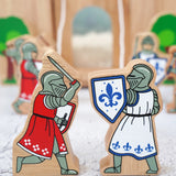Lanka Kade blue foot knight with sword  next to red knight with sword figure with a wooden castle in the background