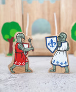 Lanka Kade red knight figure with morning star standing next to a blue knight with shield figure 