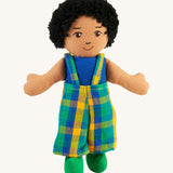 A Lanka Kade Boy Doll with Brown Skin and Black Hair. The dolls outfit will vary in colour.