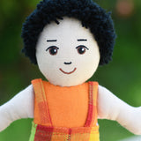 A close up of the face on the Lanka Kade Boy Doll with White Skin and Black Hair.