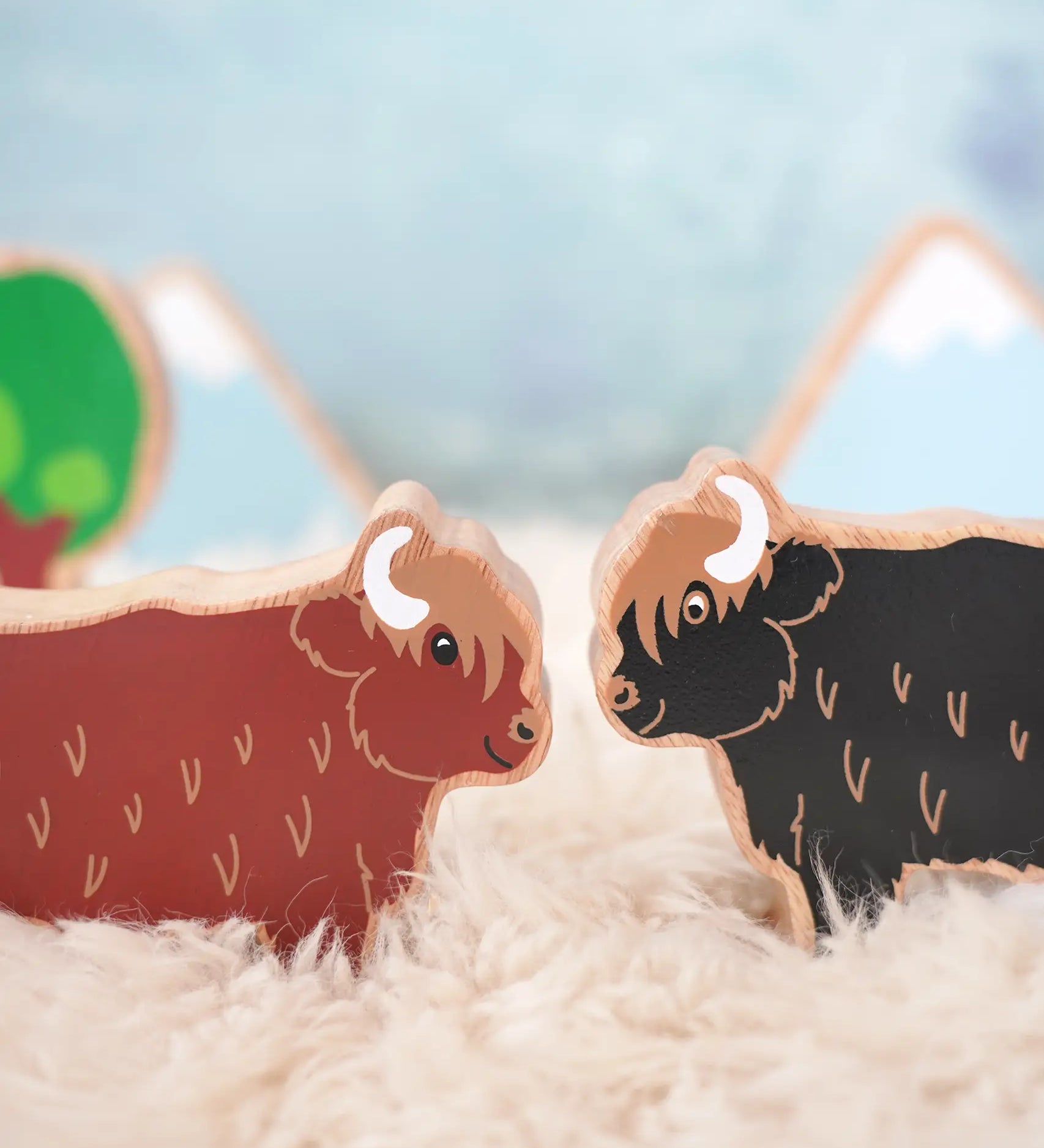 Lanka Kade brown and black highland cow figures standing face to face