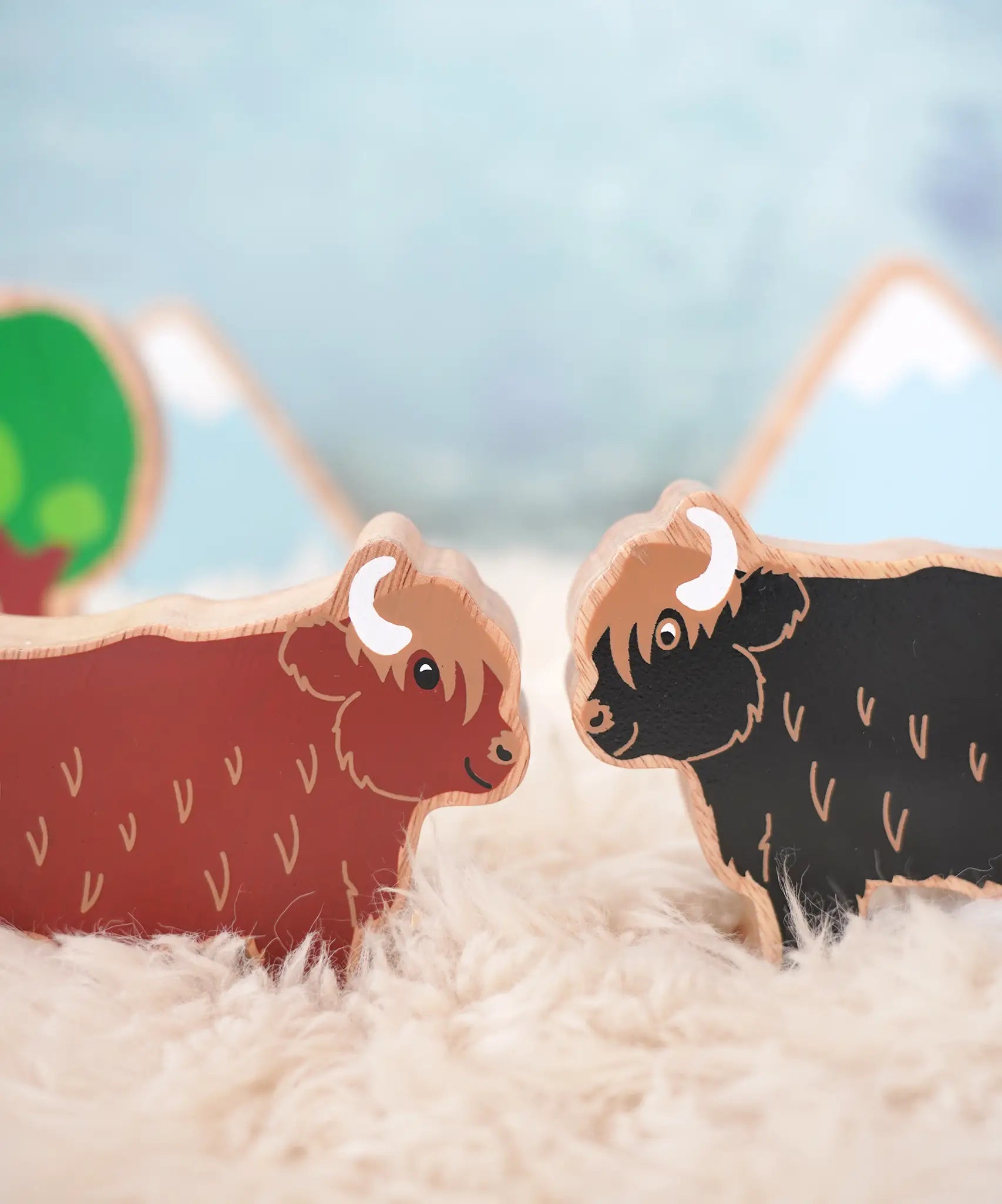 Lanka Kade brown and black highland cow figures standing face to face