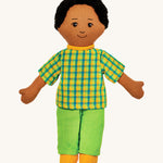 Lanka Kade dad doll with brown skin and black hair. Features a short sleeve top in a chequered style, coloured trousers and stitched on shoes. 