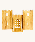 Front view of the wooden Lanka Kade castle showing the corner walls with window holes, the lowered drawbridge and gate. 