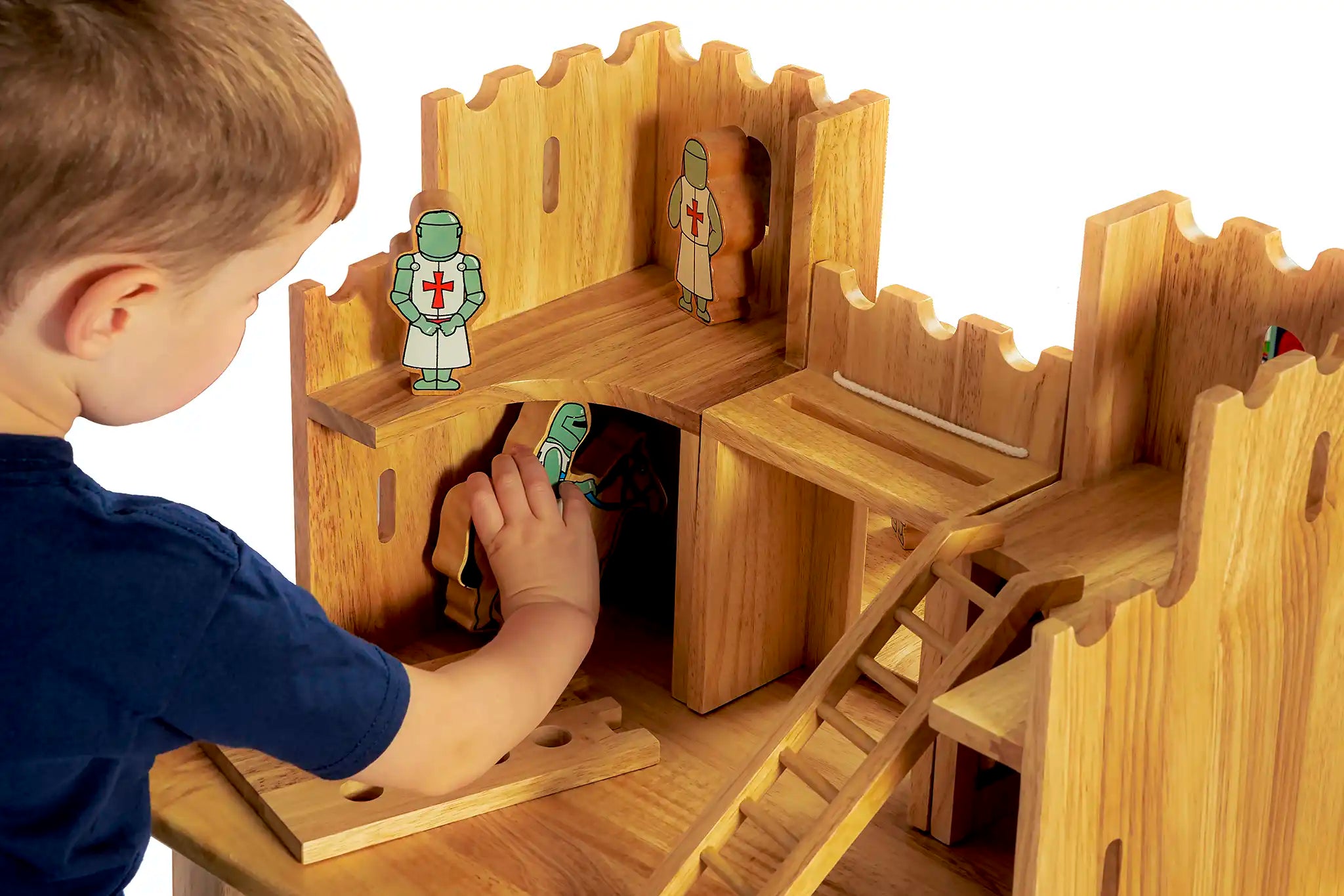 Child playing with the Lanka Kade Castle Play set & 12 Knights.