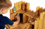 Child playing with the Lanka Kade Castle Play set & 12 Knights.