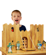 Child playing with the Lanka Kade Castle Play set & 12 Knights.