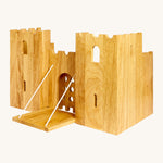Side view of the  wooden Lanka Kade castle showing the corner walls with window holes, the lowered drawbridge and the gate closed