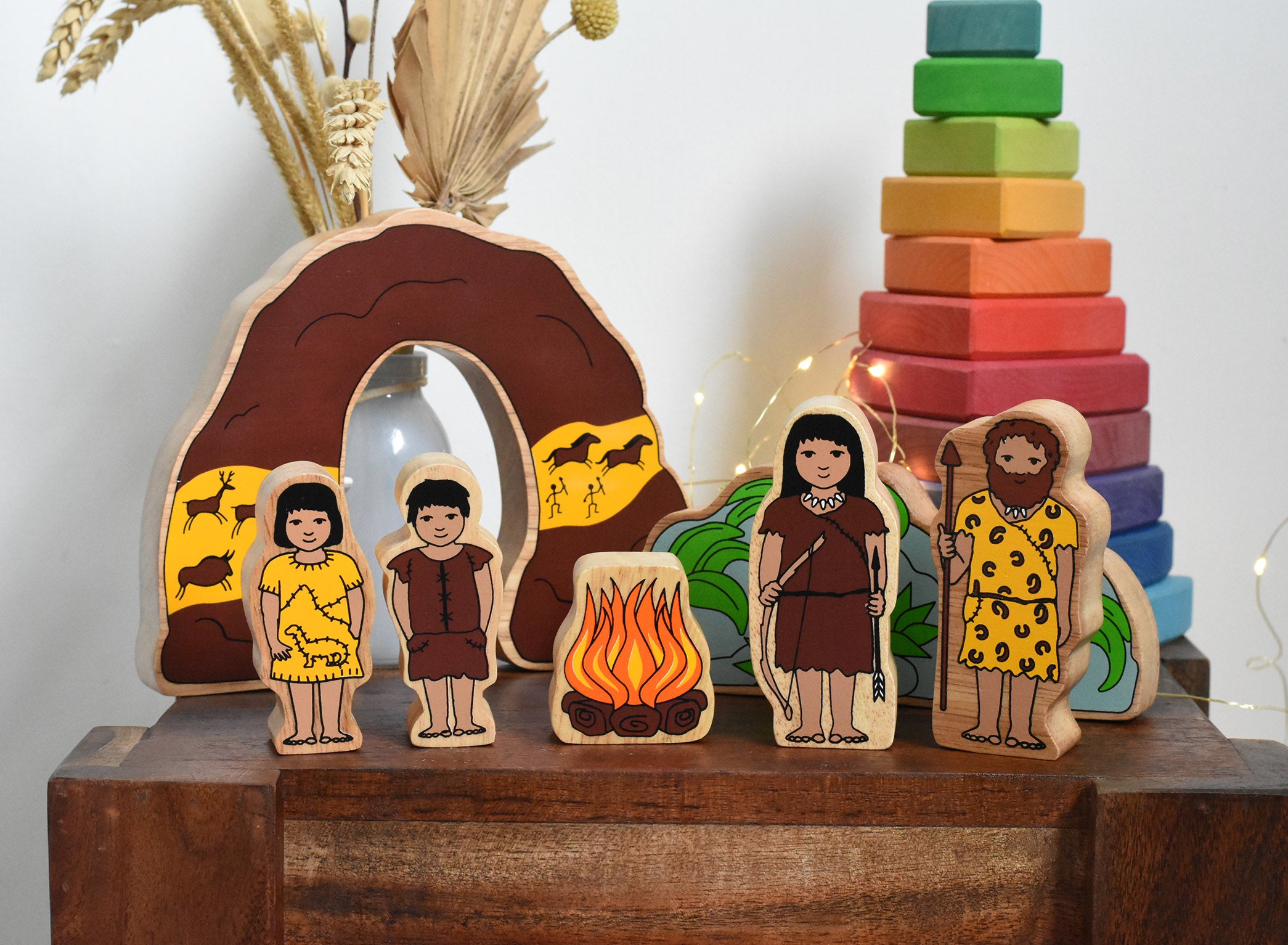 Lanka Kade Prehistoric Playset. A play set that contains 8 wooden figure and scenery pieces. These wooden toy figures are part of a huge range of Lanka Kade fair trade, wooden toys available here at Babipur.