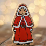 Lanka Kade Mrs Claus Christmas  wooden toy figure placed on a wooden surface in the Babipur playroom.