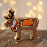 Lanka Kade Christmas reindeer wooden toy figure placed on a wooden surface in the Babipur playroom.