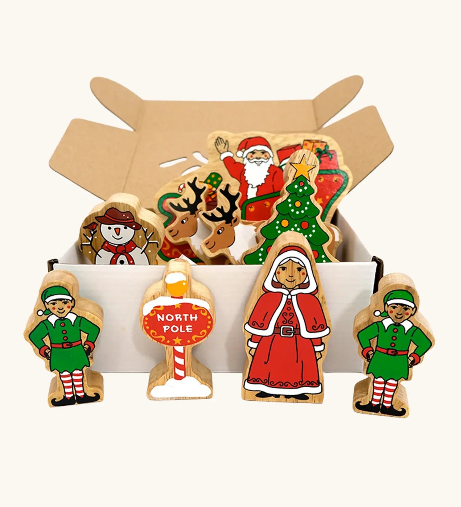 Lanka Kade wooden Christmas play set. 9 toy figures including Santa in his sleigh, Mrs Clause, Christmas Tree, Snowman, North Pole Sign, 2 Elves and 2 Reindeer in a cardboard box.