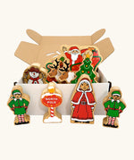 Lanka Kade wooden Christmas play set. 9 toy figures including Santa in his sleigh, Mrs Clause, Christmas Tree, Snowman, North Pole Sign, 2 Elves and 2 Reindeer in a cardboard box.