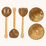 All the pieces from the Lanka Kade Coconut Shell Sand Playset pictured next to each other. Three utensils and two bowls are included in the set. 