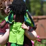 A close up of the back of the Lanka Kade Rag Doll Dad with Black Skin, Black Hair. The back of teh t-shirt s shown open.