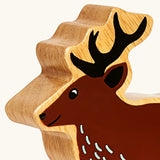 Close up of the painted facial features on the Lanka Kade dark brown stag wooden toy figure.