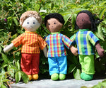 Three Lanka Kade dad dolls placed on a slate surface outdoors.  One doll has white skin and blonde hair, one has brown skin and black hair and the third has black skin and black hair. Their outfits are all made from sari offcut material so will come in random colours. 