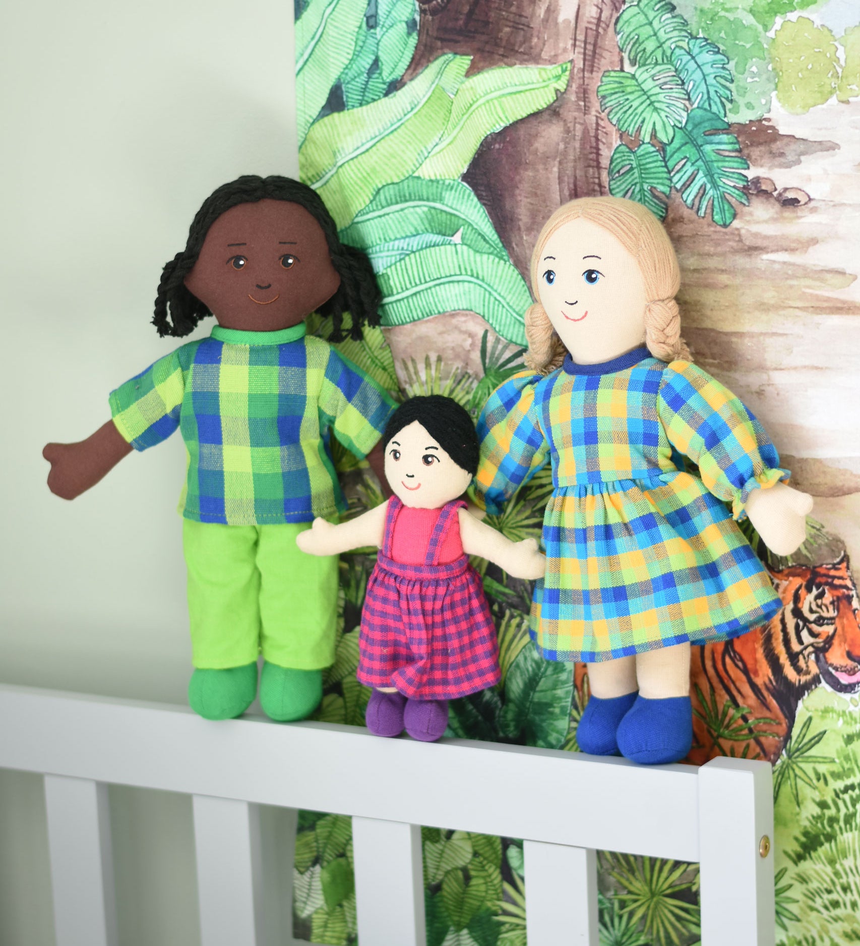 Lanka Kade Rag Doll family, Mum with White Skin and  Blonde Hair, girl with black hair and white skin and dad with black skin and black hair.
