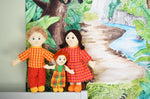 A soft Lanka Kade Fair Trade doll family. A white skin, blonde hair dad, white skin, black hair mum and a white skin and red haired boy. 