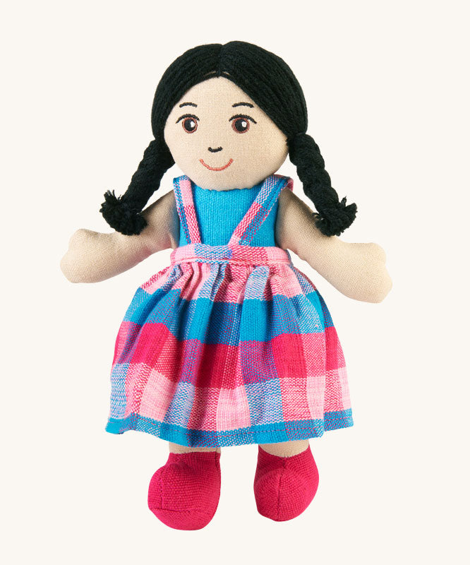 A Lanka Kade Girl Doll with White Skin and Black Hair. The doll's dress will vary in colour.