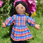 A Lanka Kade Rag Doll Mum with Brown Skin and Black Hair. The doll is wearing a dress that has been made using off cuts from sari materials.