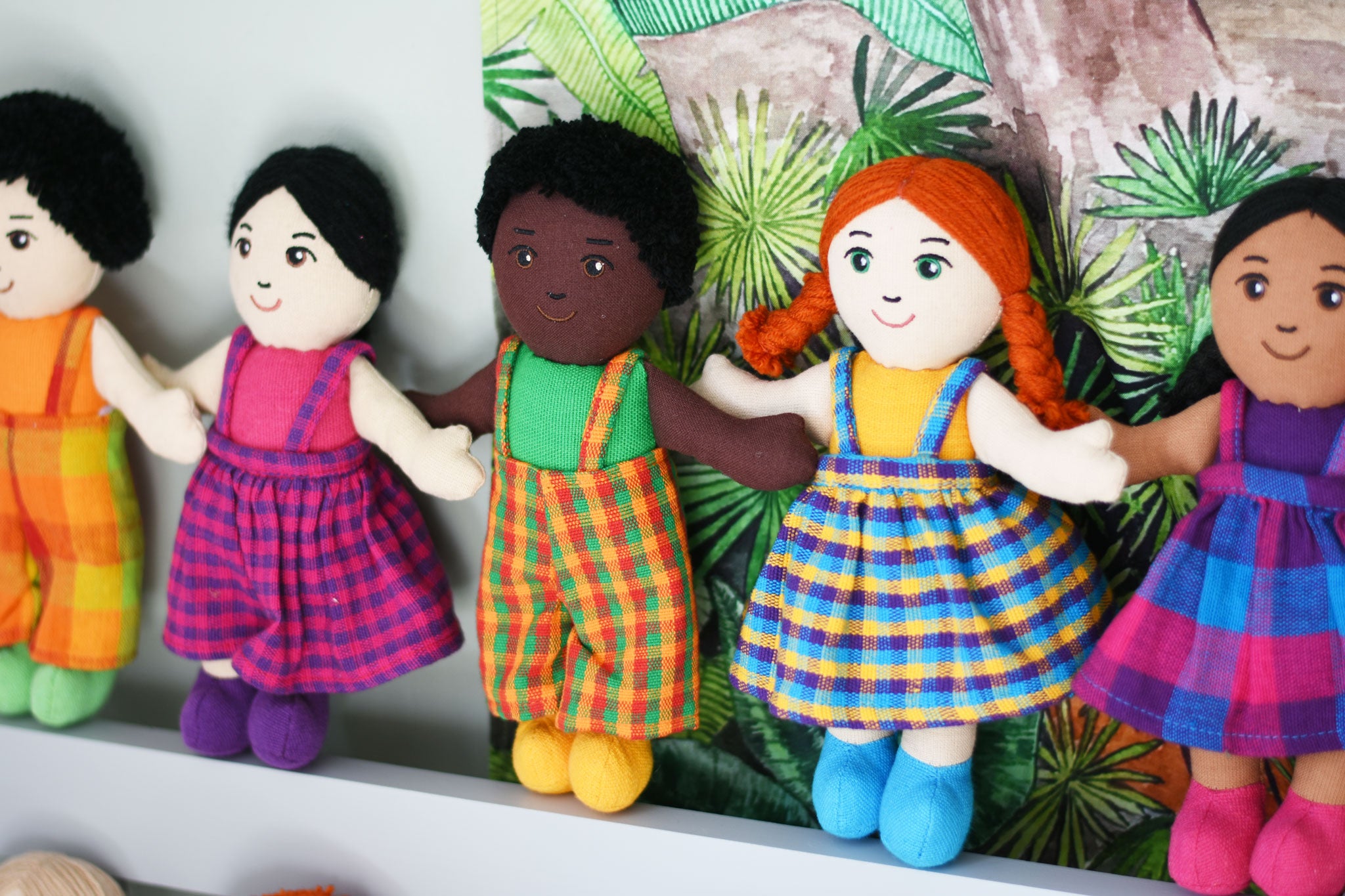 A line up of Lanka Kade fair trade girl and boy rag dolls. 