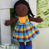 A Lanka Kade Girl Doll with Black Skin and Black Hair. The dolls outfit colour will vary.