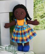 A Lanka Kade Girl Doll with Black Skin and Black Hair. The dolls outfit colour will vary.