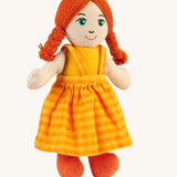 A Lanka Kade Girl Doll with White Skin and Red Hair.. The colour of the dolls outfit will vary.