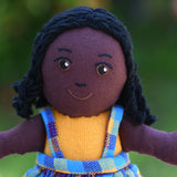 A close up of the Lanka Kade Girl Doll with Black Skin and Black Hair face.