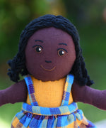 A close up of the Lanka Kade Girl Doll with Black Skin and Black Hair face.
