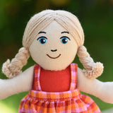 A close up of the Lanka Kade Girl Dolls face. The doll has white skin and Blonde Hair with blue eyes.