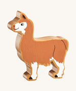 A Lanka Kade brown and white Llama wooden toy figure. These wooden toy figures are part of a huge range of Lanka Kade fair trade, wooden toys available here at Babipur.