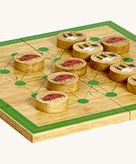 A close up of the Lanka Kade minibeast wooden board game showing the circular counter detail and thickness of the board and counters