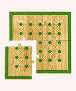 A close up of the Lanka Kade minibeast wooden board game with one piece of the board taken off showing the jigsaw detail 