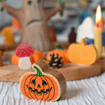 A Lanka Kade Orange Pumpkin placed in front of an Autumn themed celebration ring set up. 