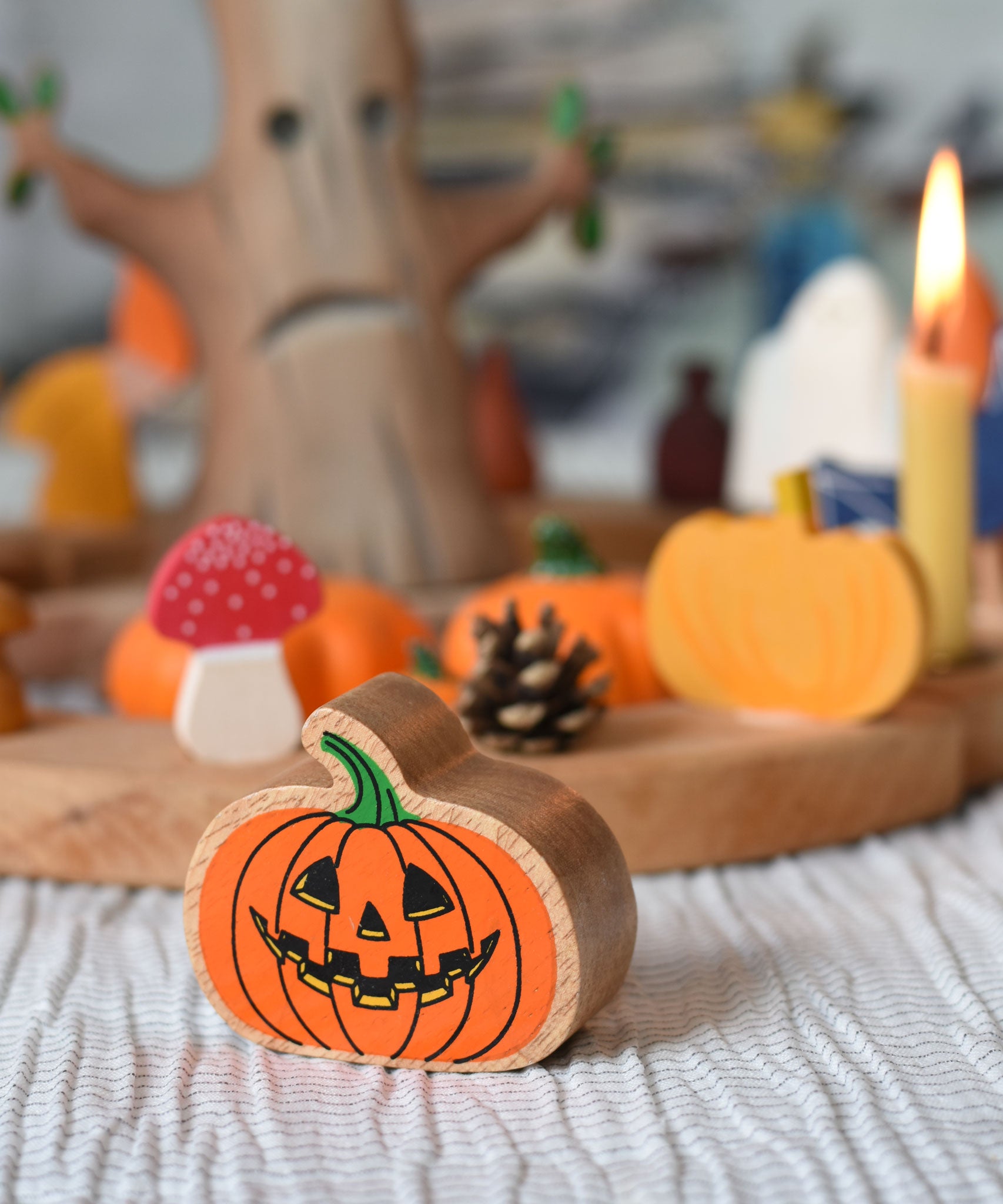 A Lanka Kade Orange Pumpkin placed in front of an Autumn themed celebration ring set up. 