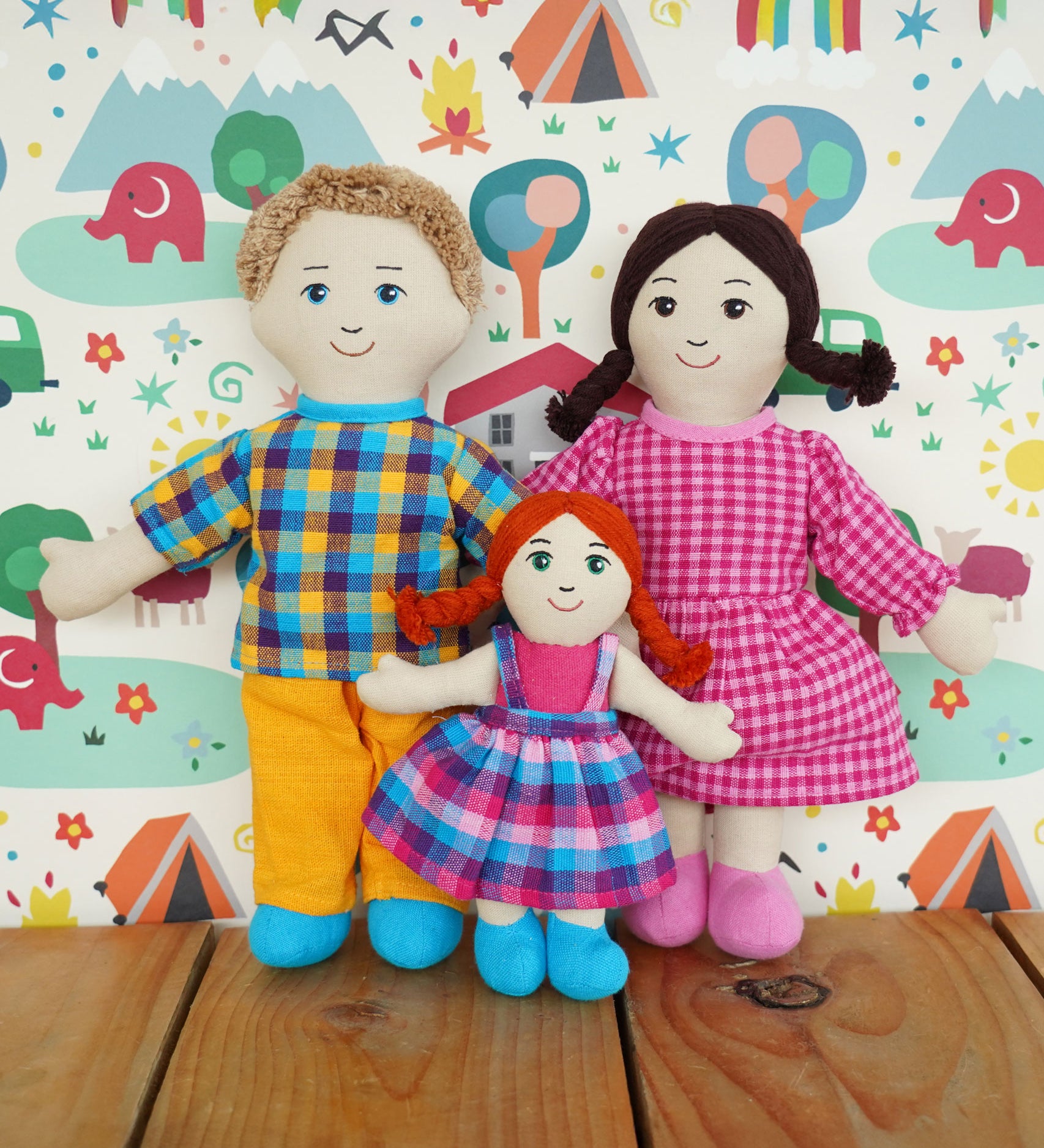 A Lanka Kade Rag Doll Mum with White Skin, Black Hair with Dad with white skin and blond hair and a girl doll with white skin and red hair. 